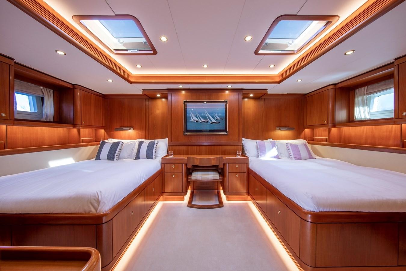 a room with a couple of beds aboard MYSTERY Yacht for Sale