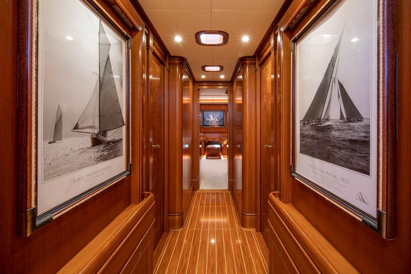 a hallway with wood walls and wood floors aboard MYSTERY Yacht for Sale