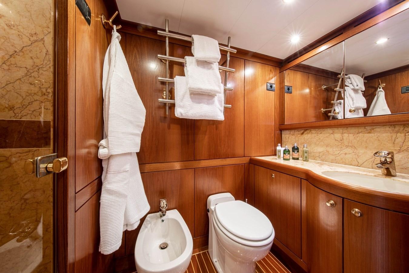 a bathroom with a toilet and sink aboard MYSTERY Yacht for Sale