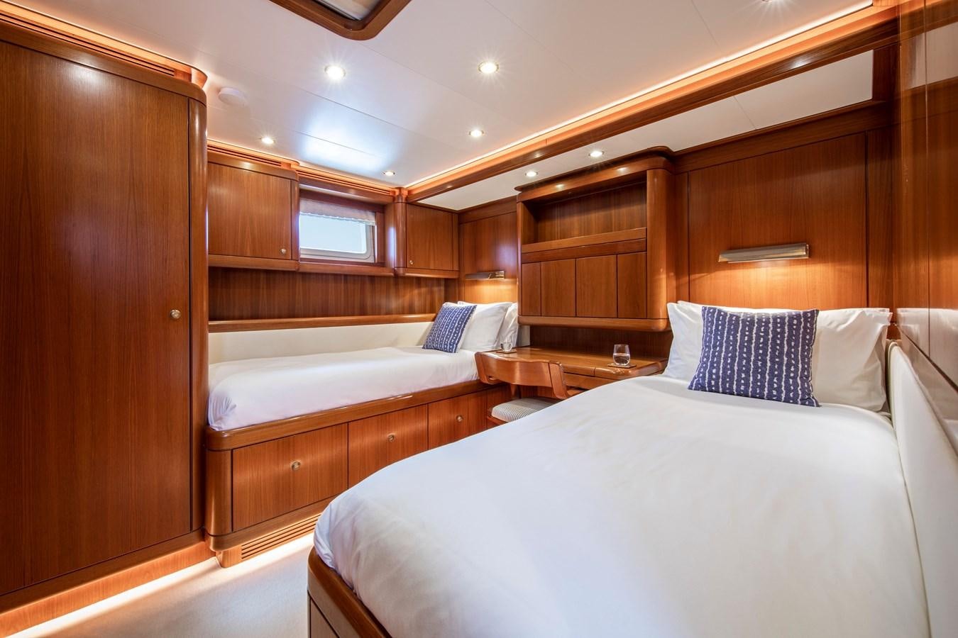 a room with two beds aboard MYSTERY Yacht for Sale