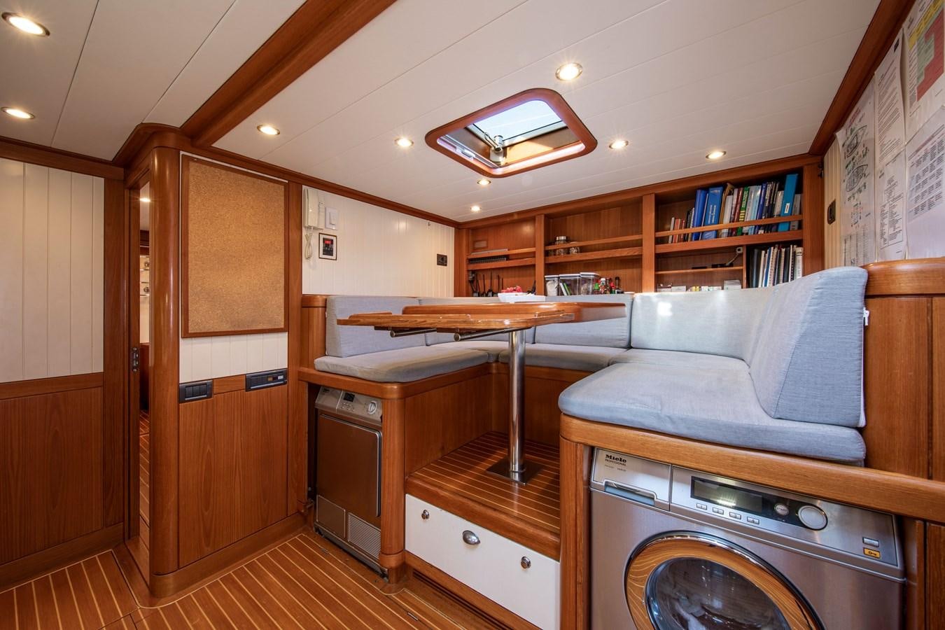 a room with a bed and a fireplace aboard MYSTERY Yacht for Sale