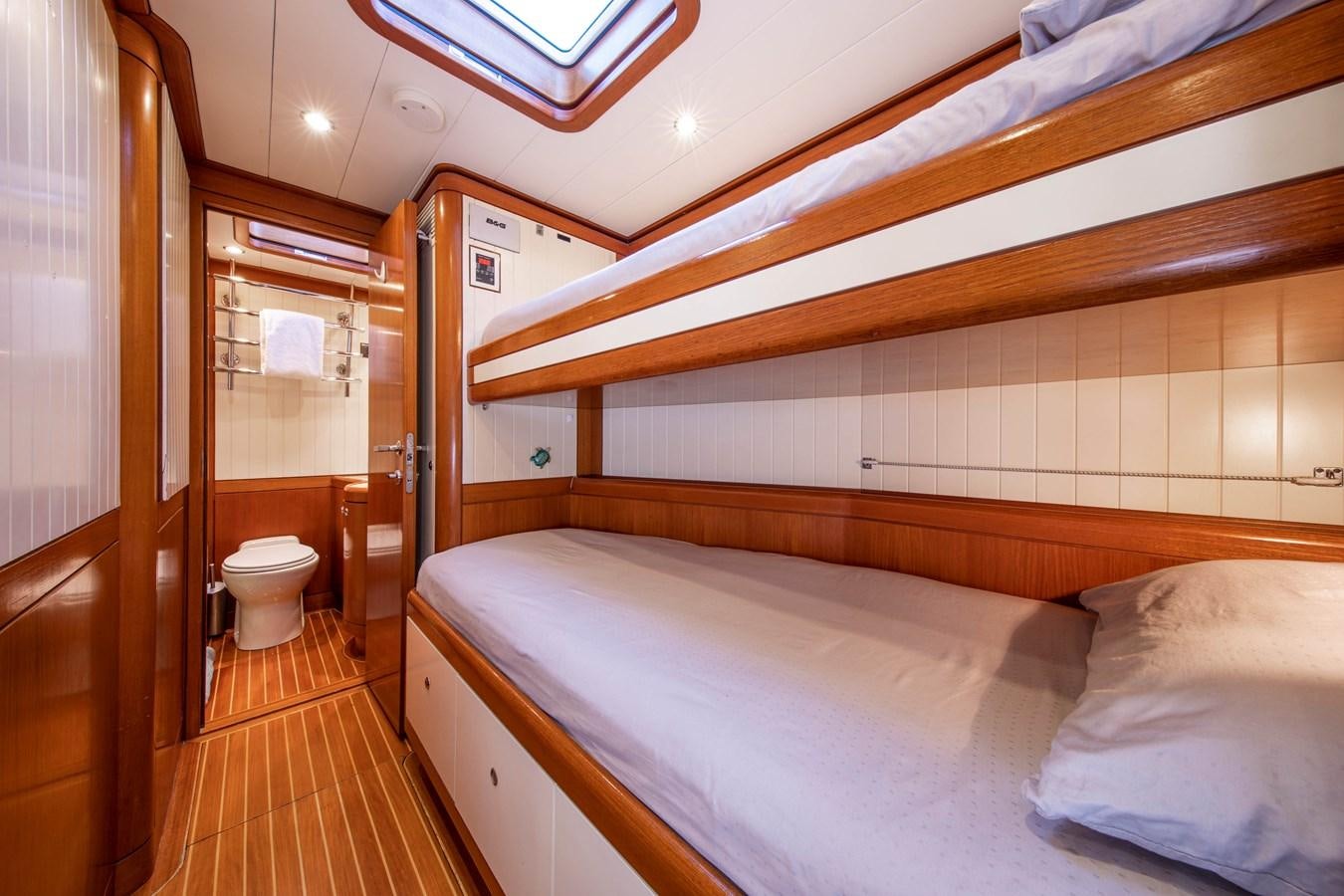 a room with a bed and a mirror aboard MYSTERY Yacht for Sale