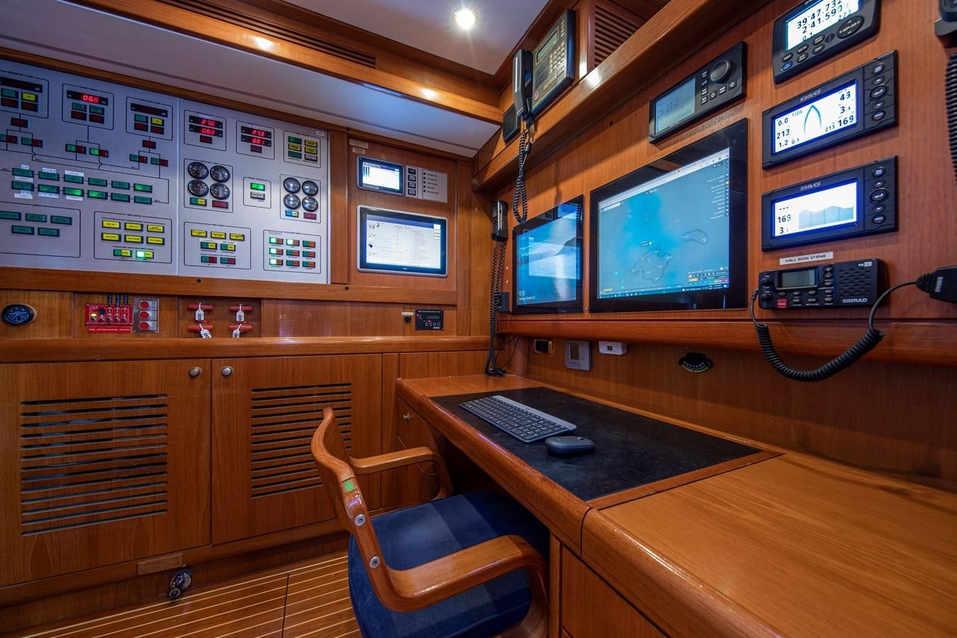 a room with a desk and computer aboard MYSTERY Yacht for Sale
