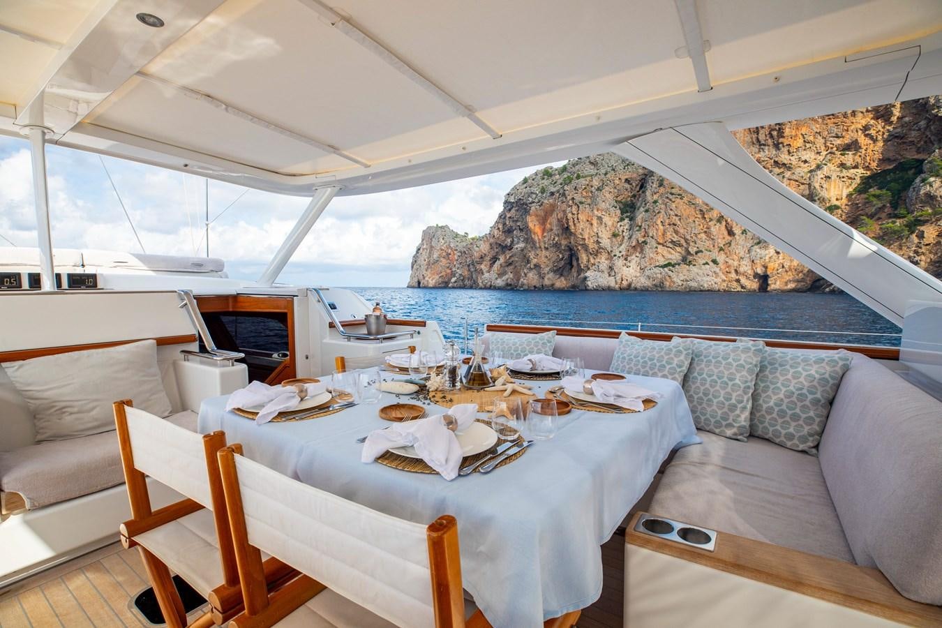 a table set for a meal aboard MYSTERY Yacht for Sale