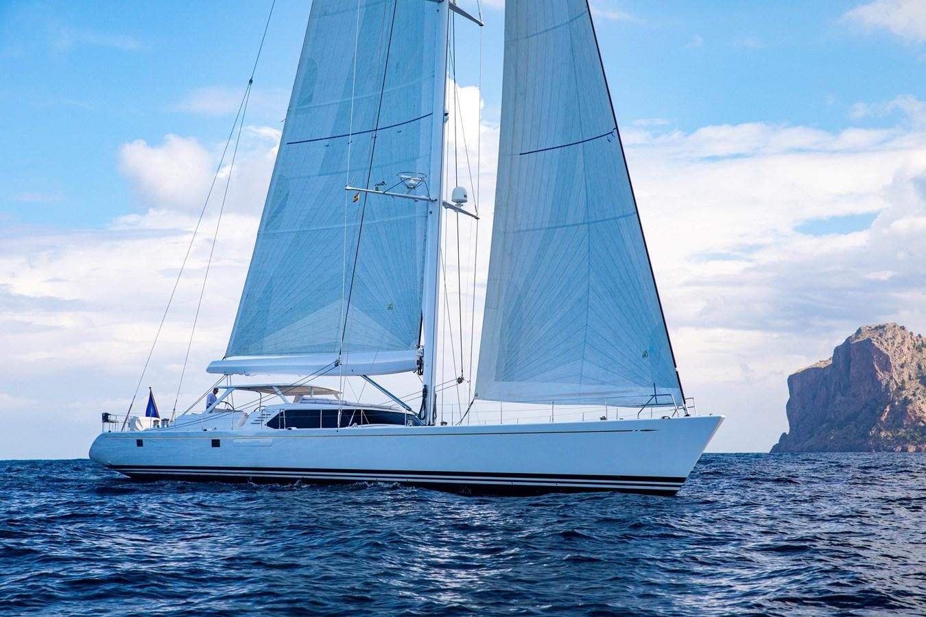 a white boat on the water aboard MYSTERY Yacht for Sale