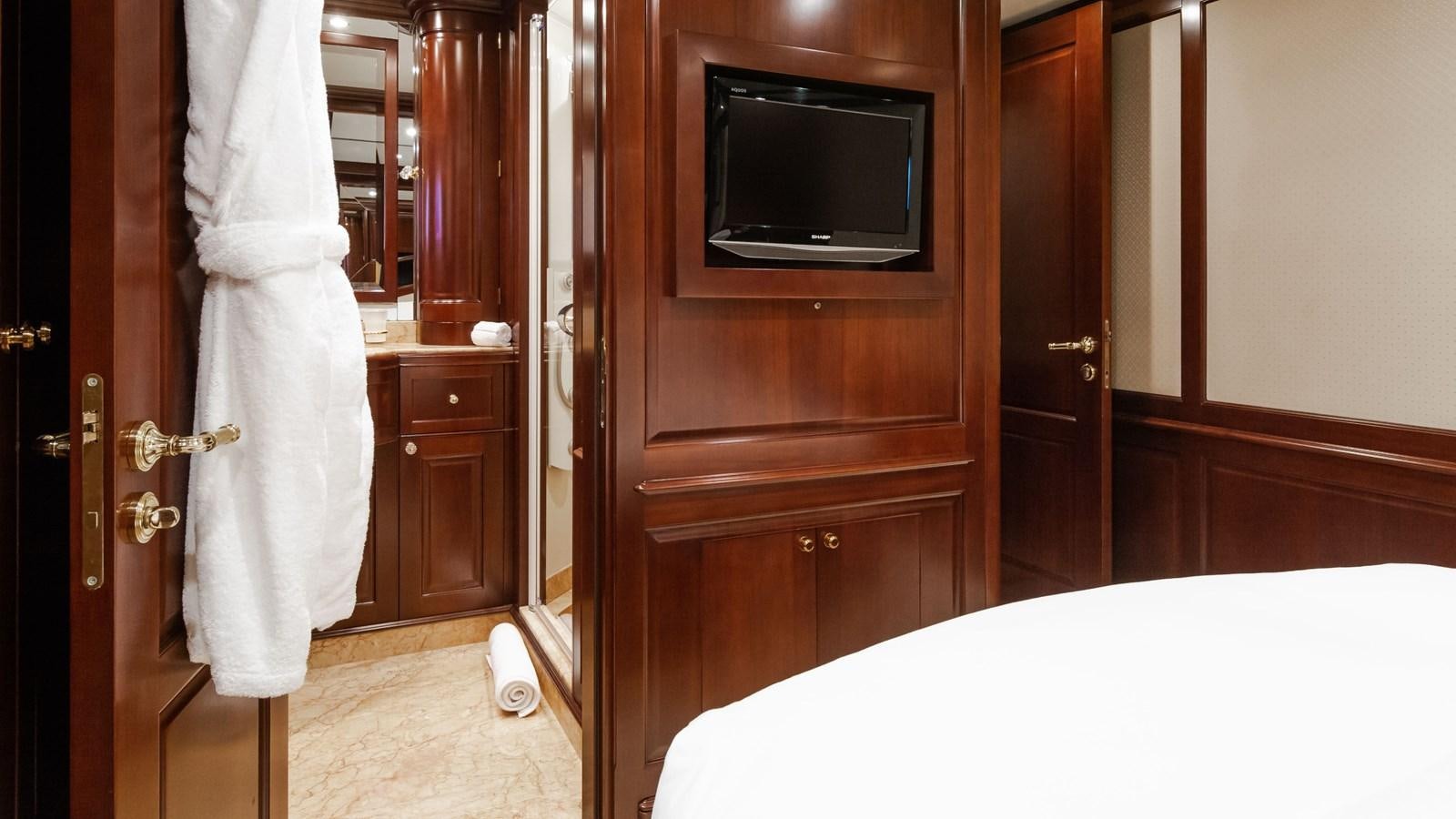 a room with a television and a closet aboard GIORGIA Yacht for Sale