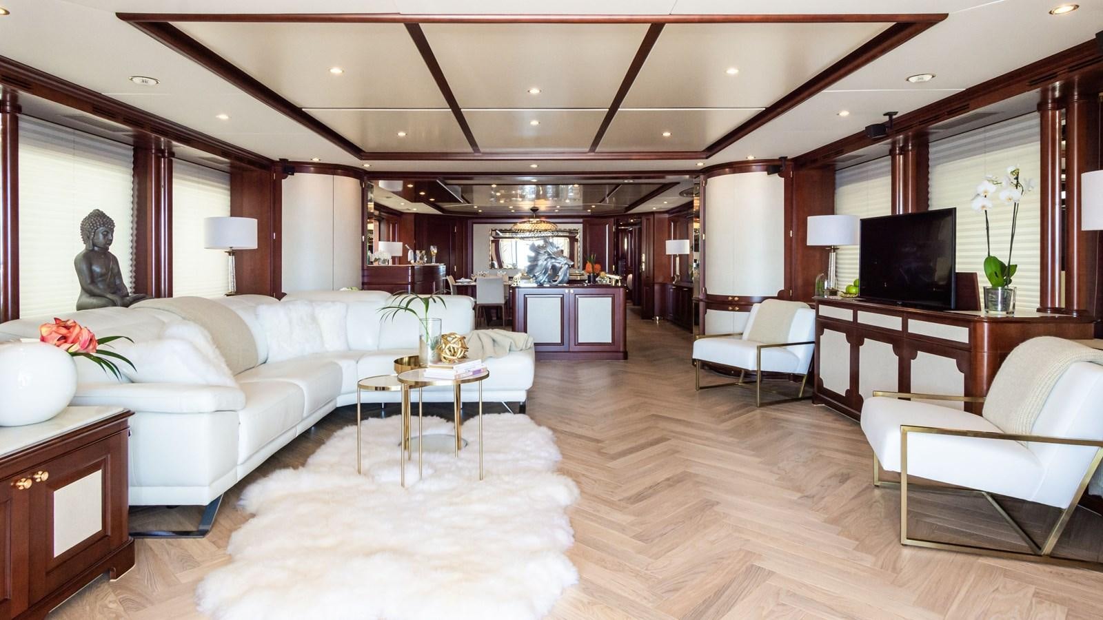 a living room with a large wood ceiling and a large television aboard GIORGIA Yacht for Sale