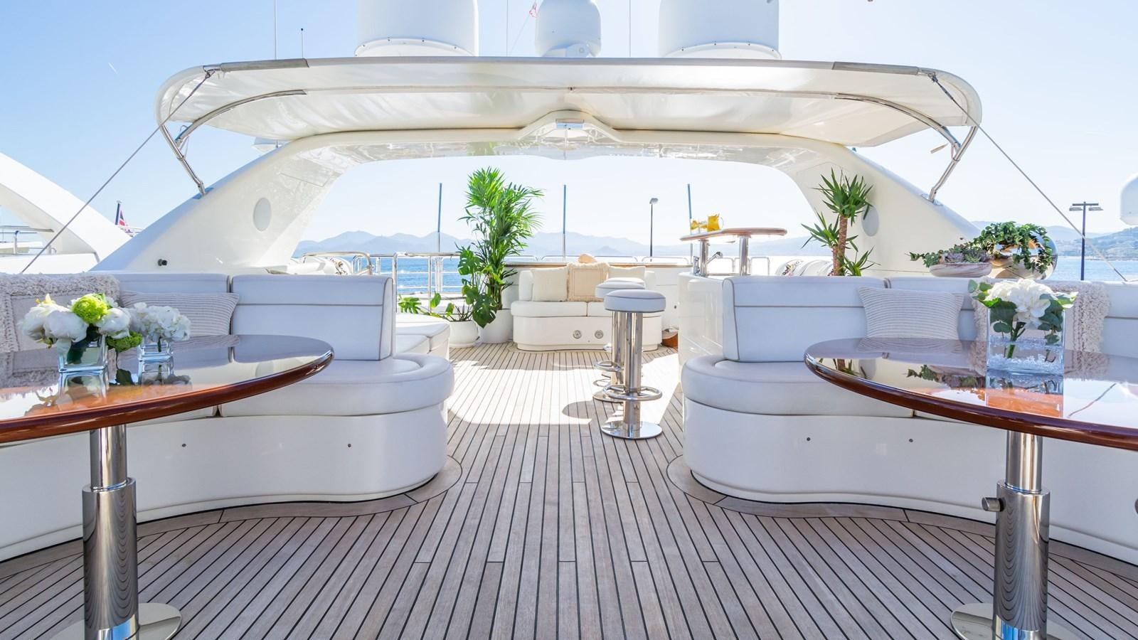 a room with a table and chairs aboard GIORGIA Yacht for Sale