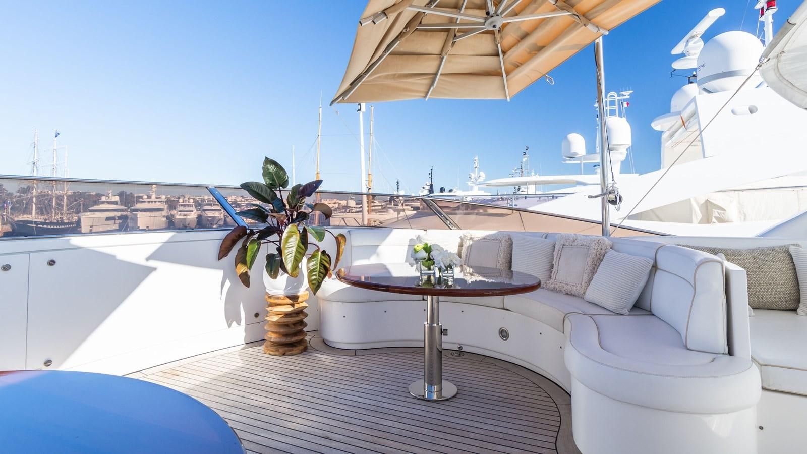 a table and chairs on a deck aboard GIORGIA Yacht for Sale