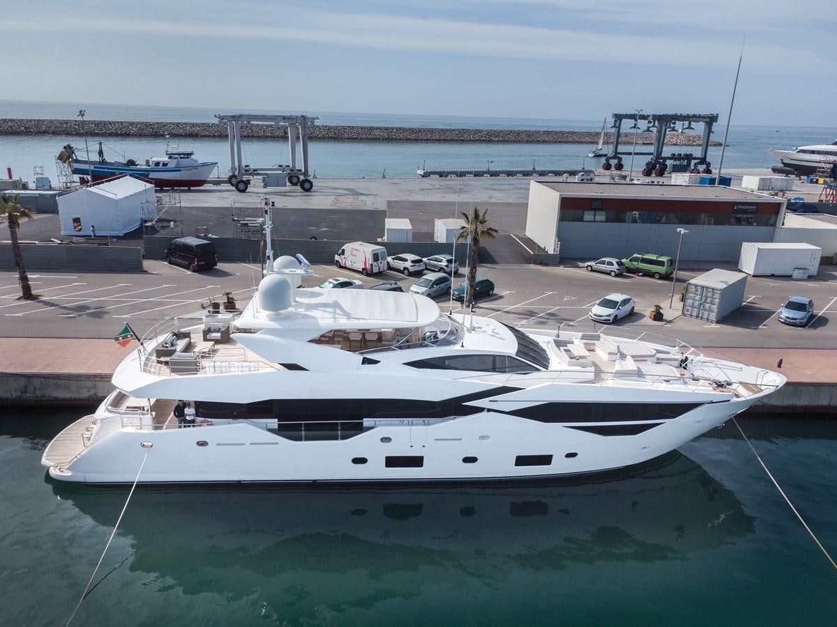 a large white yacht docked at a pier aboard SUNSEEKER 116 -  QART HADASHT Yacht for Sale