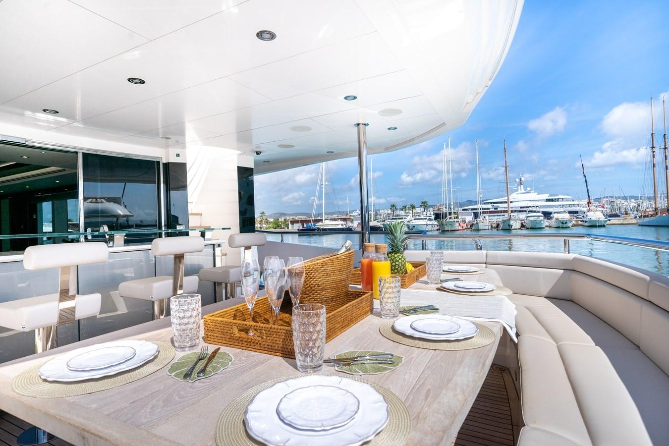 a table with plates and glasses on it aboard SUNSEEKER 116 -  QART HADASHT Yacht for Sale