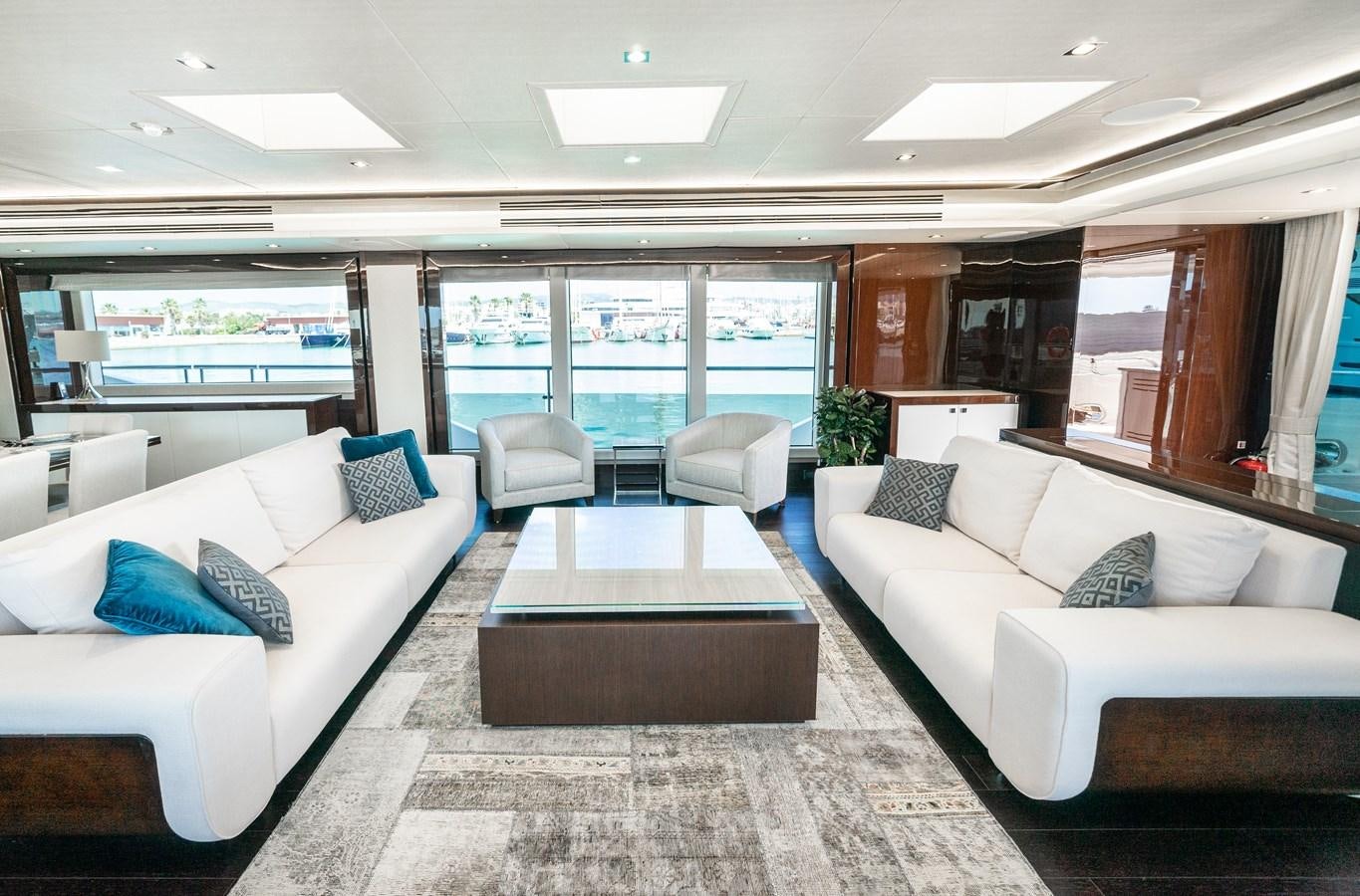 a living room with white couches aboard SUNSEEKER 116 -  QART HADASHT Yacht for Sale