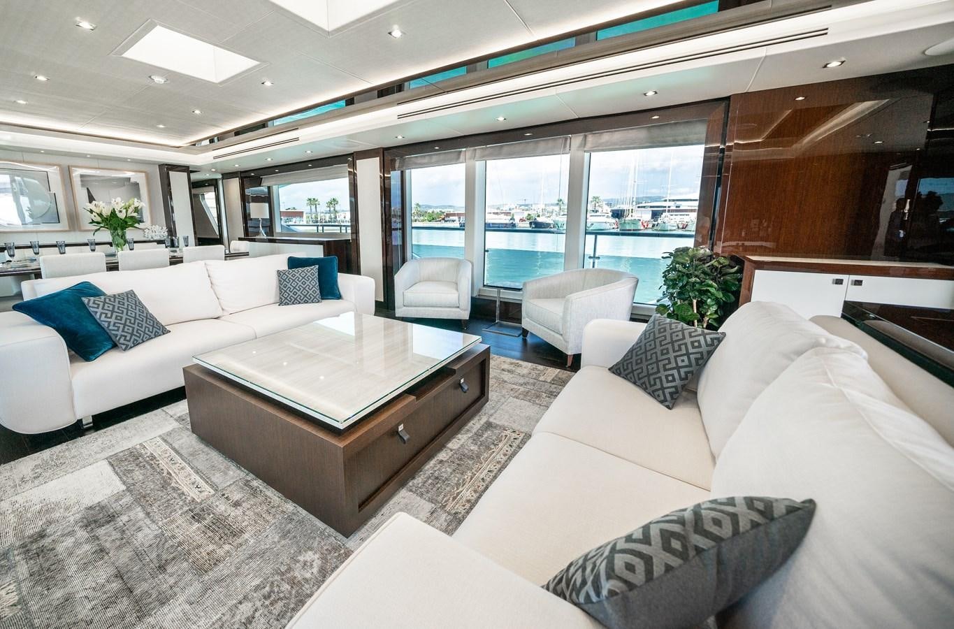 a living room with a couch and a coffee table aboard SUNSEEKER 116 -  QART HADASHT Yacht for Sale