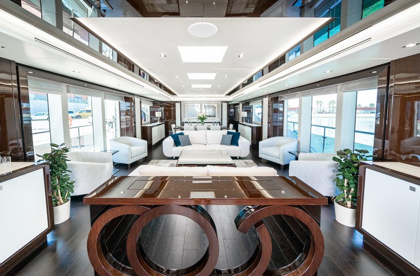 a large room with a table and chairs aboard SUNSEEKER 116 -  QART HADASHT Yacht for Sale