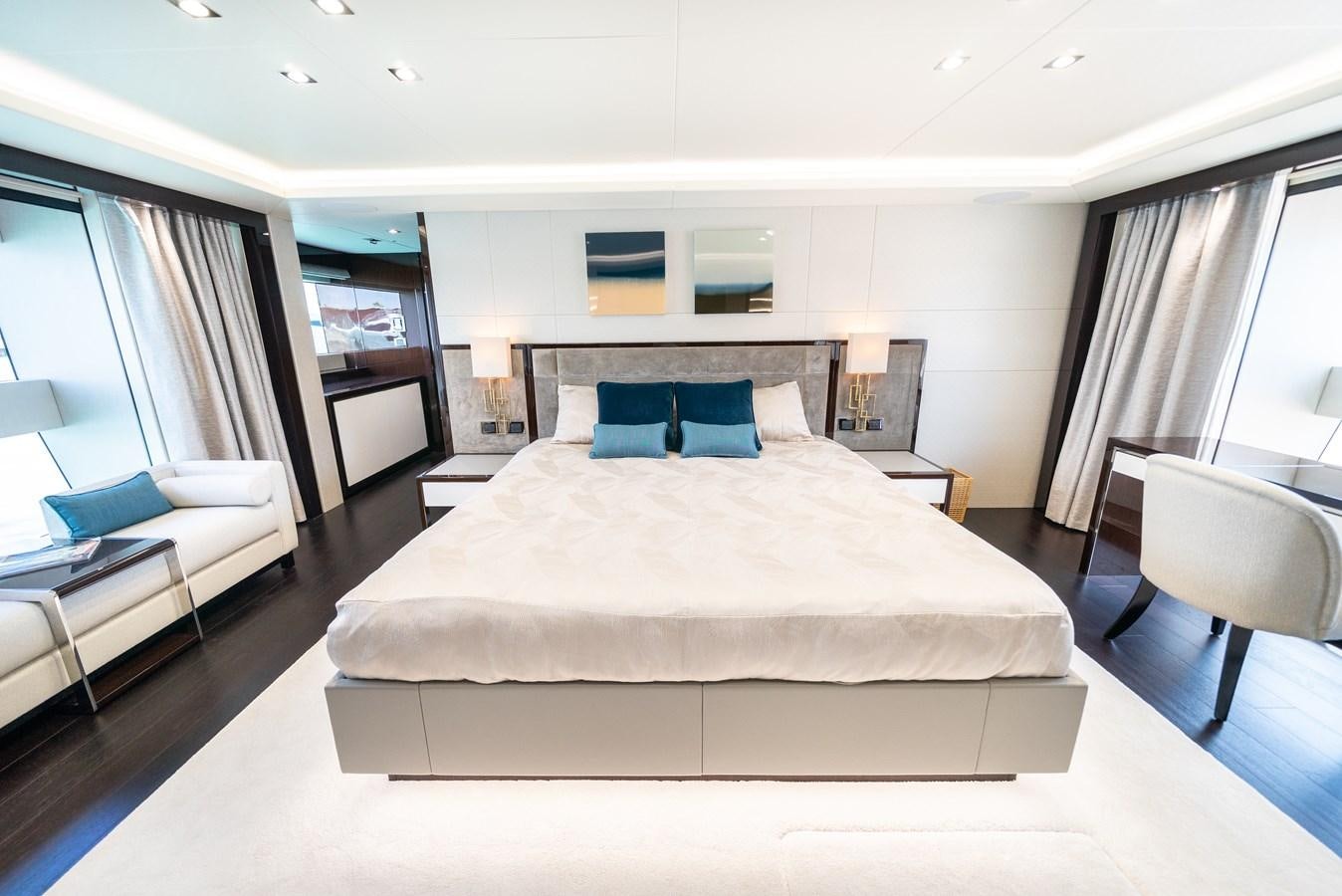 a hotel room with a bed and a chair aboard SUNSEEKER 116 -  QART HADASHT Yacht for Sale
