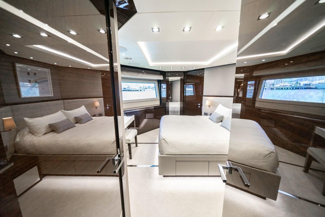 a room with a couch and a television aboard SUNSEEKER 116 -  QART HADASHT Yacht for Sale
