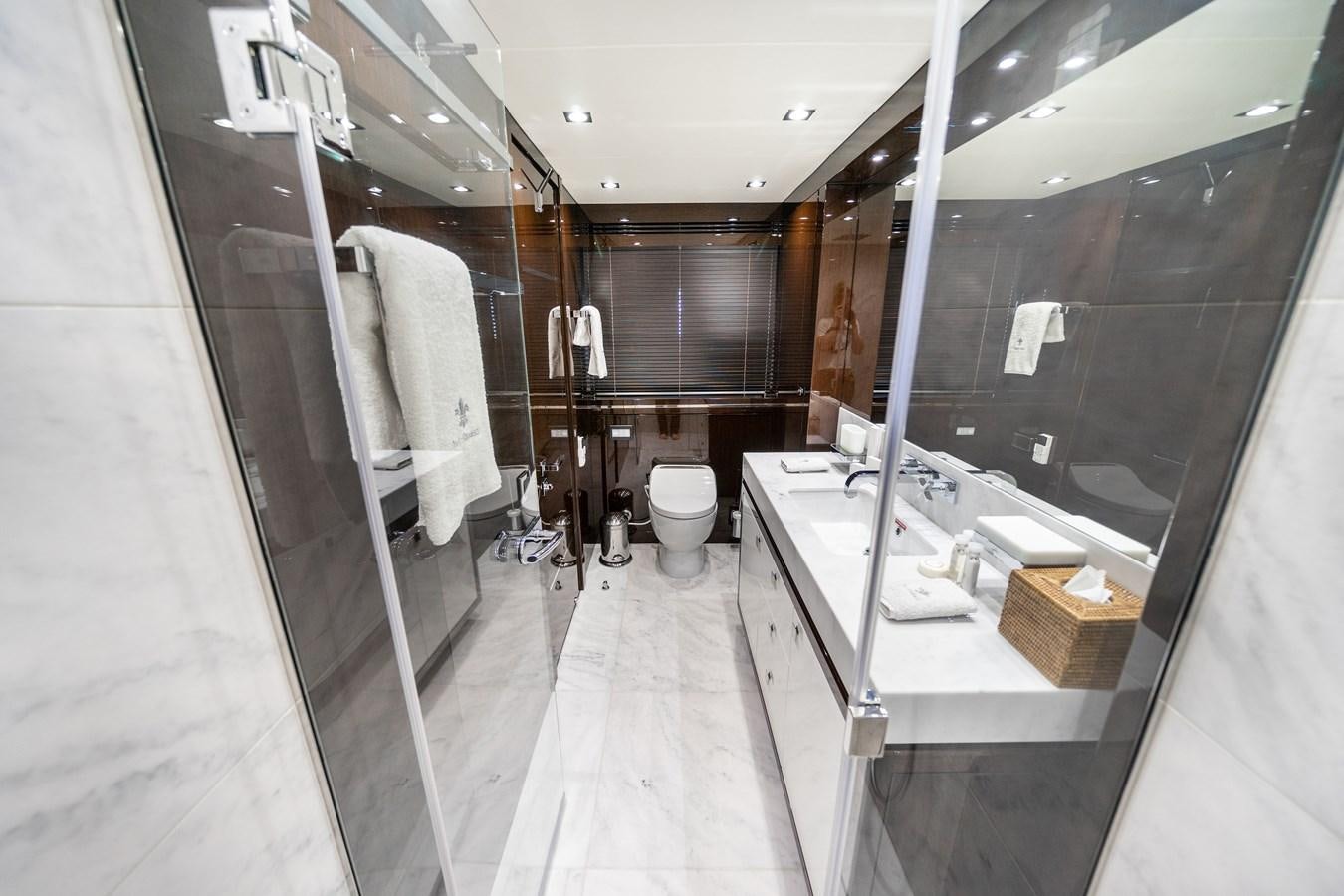 a bathroom with a large mirror aboard SUNSEEKER 116 -  QART HADASHT Yacht for Sale