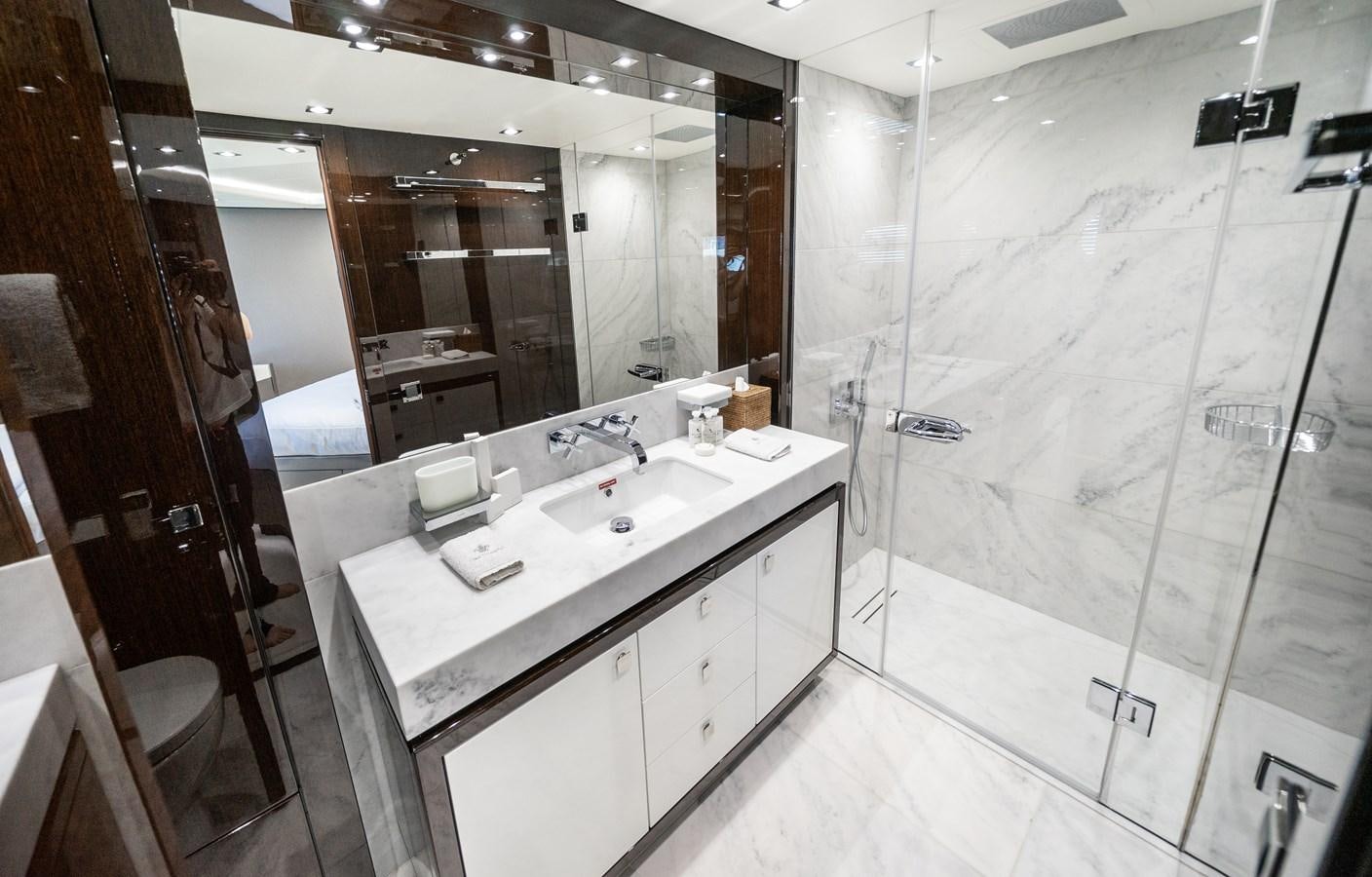 a bathroom with a large mirror aboard SUNSEEKER 116 -  QART HADASHT Yacht for Sale