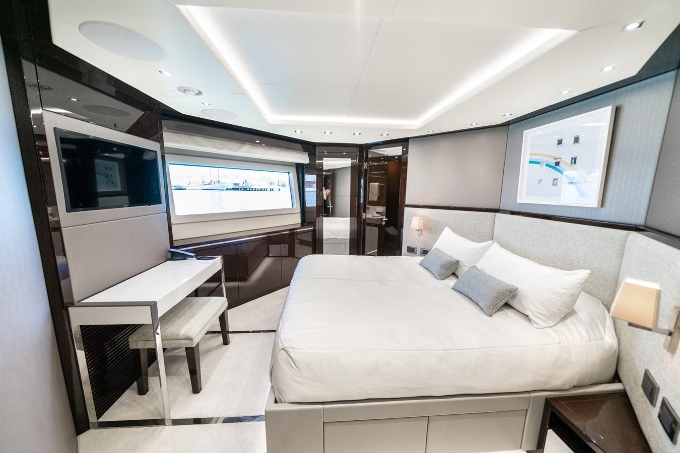 a room with a bed and a table aboard SUNSEEKER 116 -  QART HADASHT Yacht for Sale