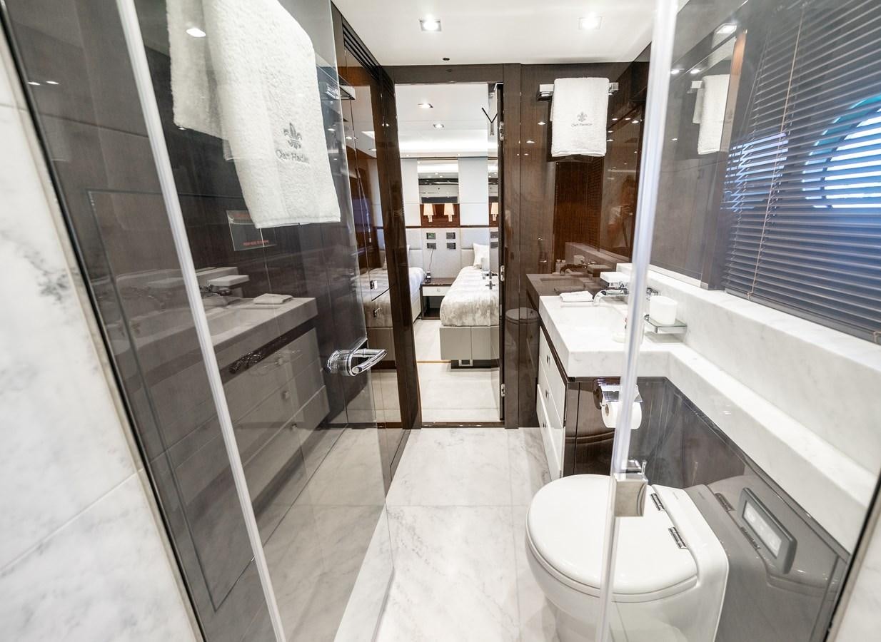 a bathroom with a glass shower aboard SUNSEEKER 116 -  QART HADASHT Yacht for Sale