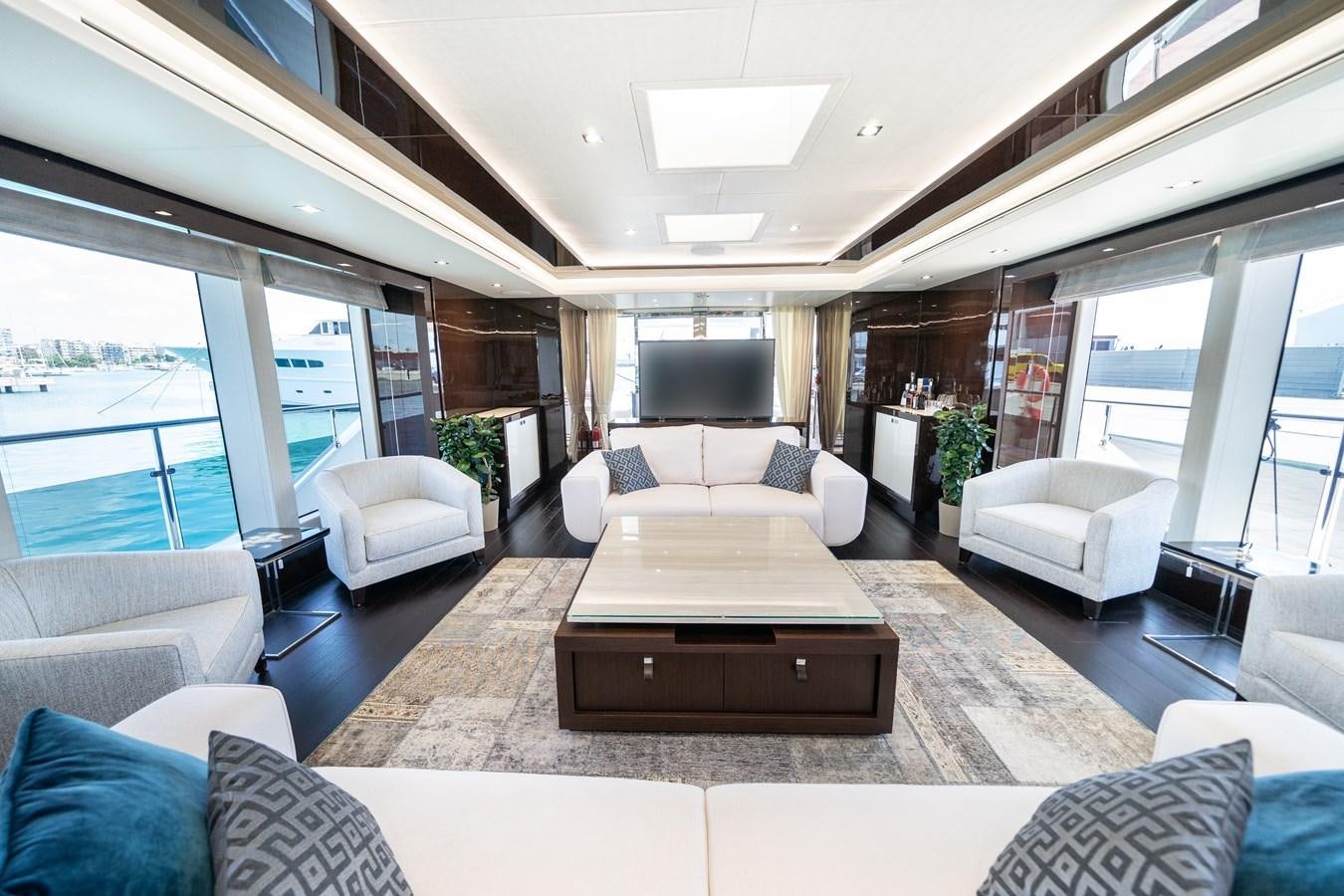 a living room with a large window aboard SUNSEEKER 116 -  QART HADASHT Yacht for Sale