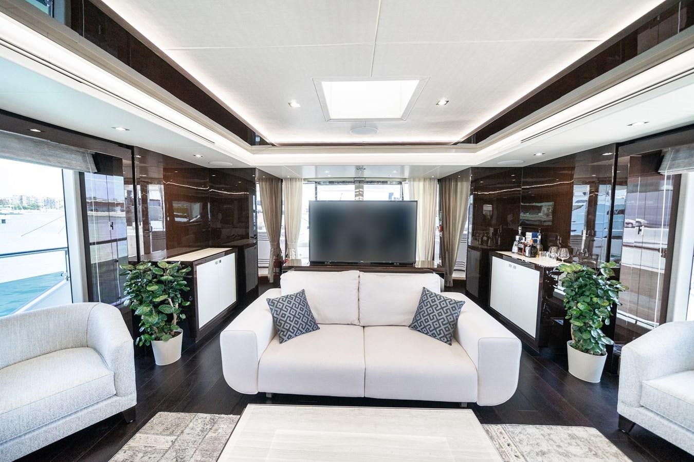 a living room with a large screen aboard SUNSEEKER 116 -  QART HADASHT Yacht for Sale