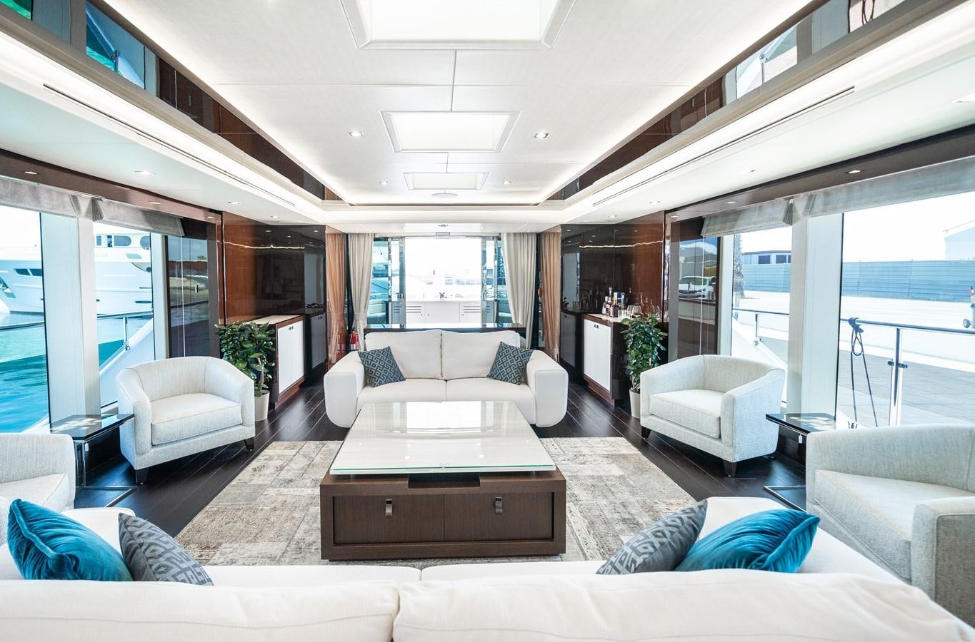 a living room with a large window aboard SUNSEEKER 116 -  QART HADASHT Yacht for Sale