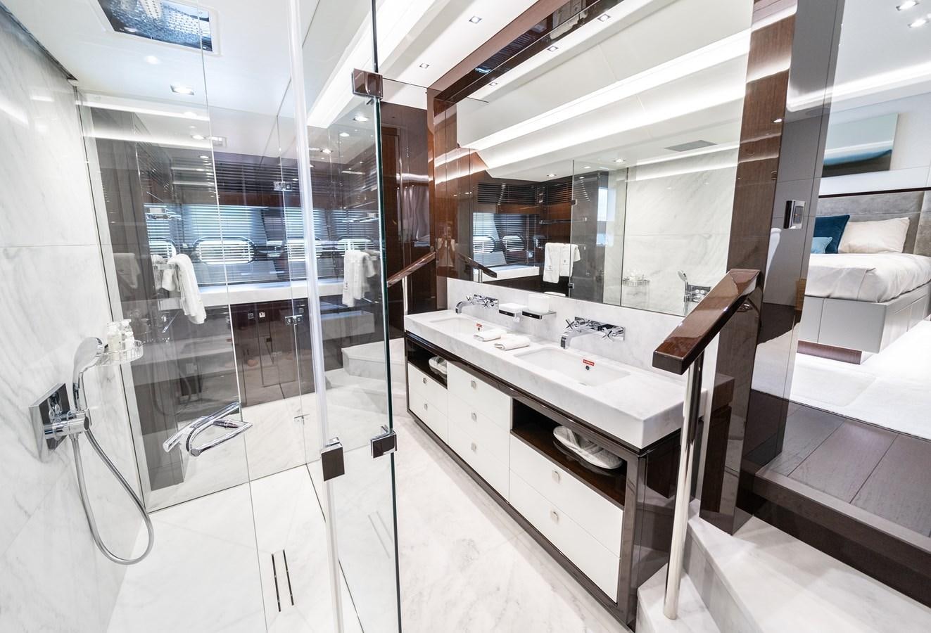 a bathroom with a sink and a mirror aboard SUNSEEKER 116 -  QART HADASHT Yacht for Sale