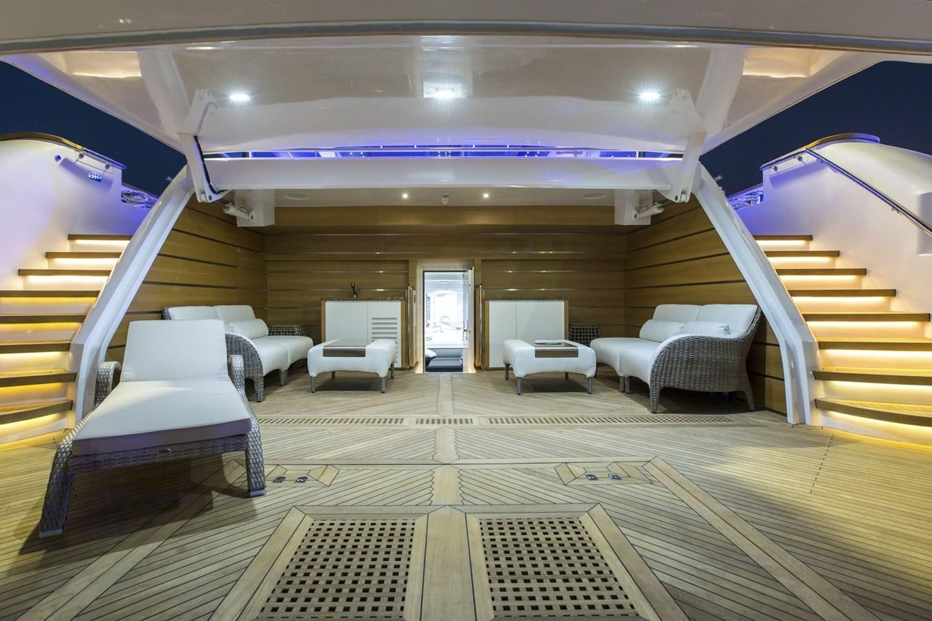 a room with a staircase and chairs aboard MAJESTY 155 Yacht for Sale