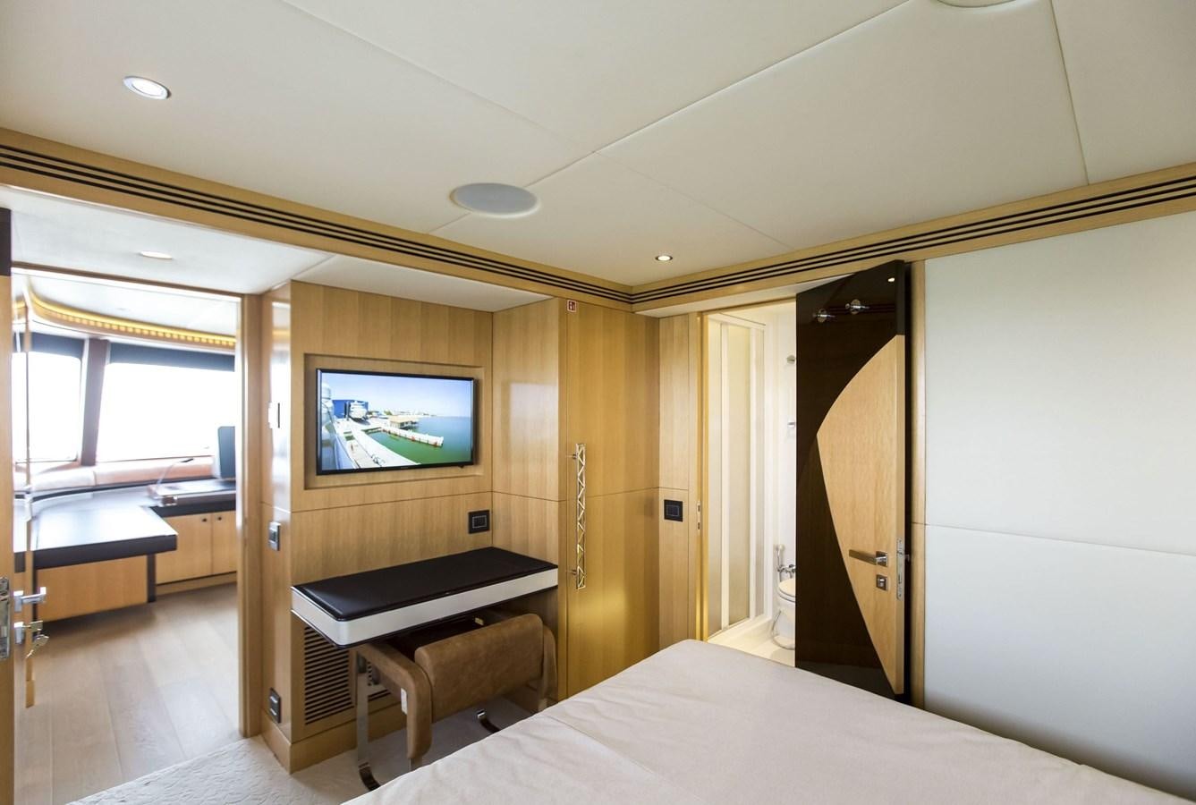 a room with a bed and a television aboard MAJESTY 155 Yacht for Sale