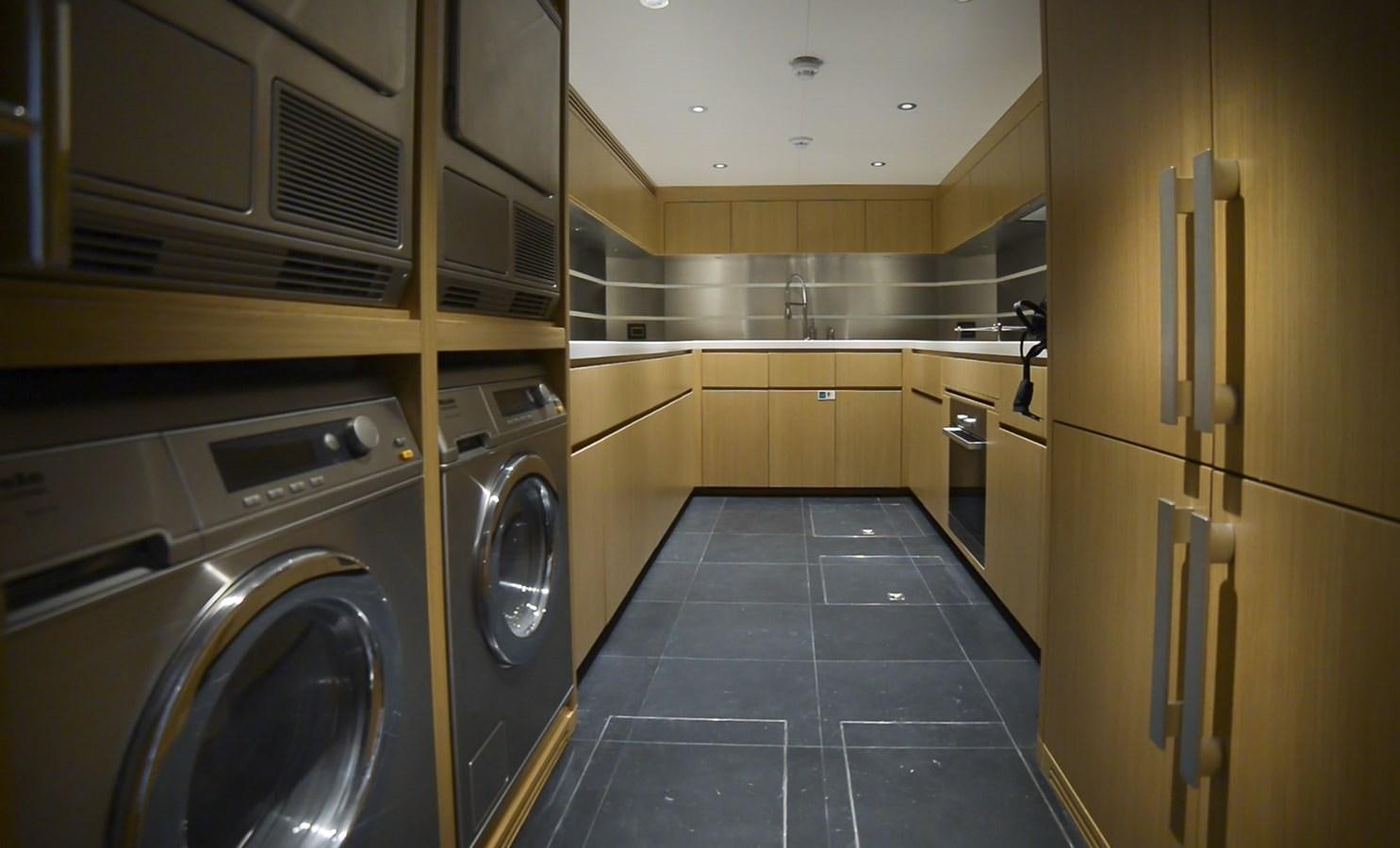 a kitchen with stainless steel appliances aboard MAJESTY 155 Yacht for Sale