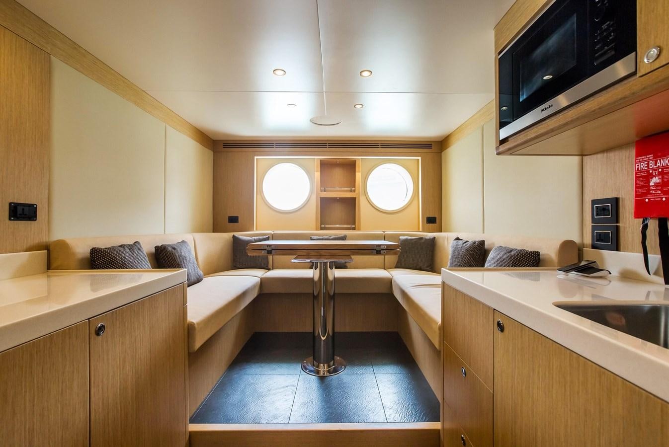 a living room with a large tv aboard MAJESTY 155 Yacht for Sale