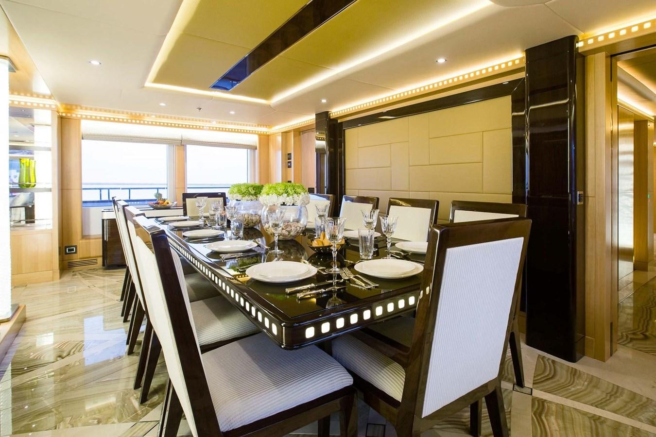 a dining table set for a meal aboard MAJESTY 155 Yacht for Sale