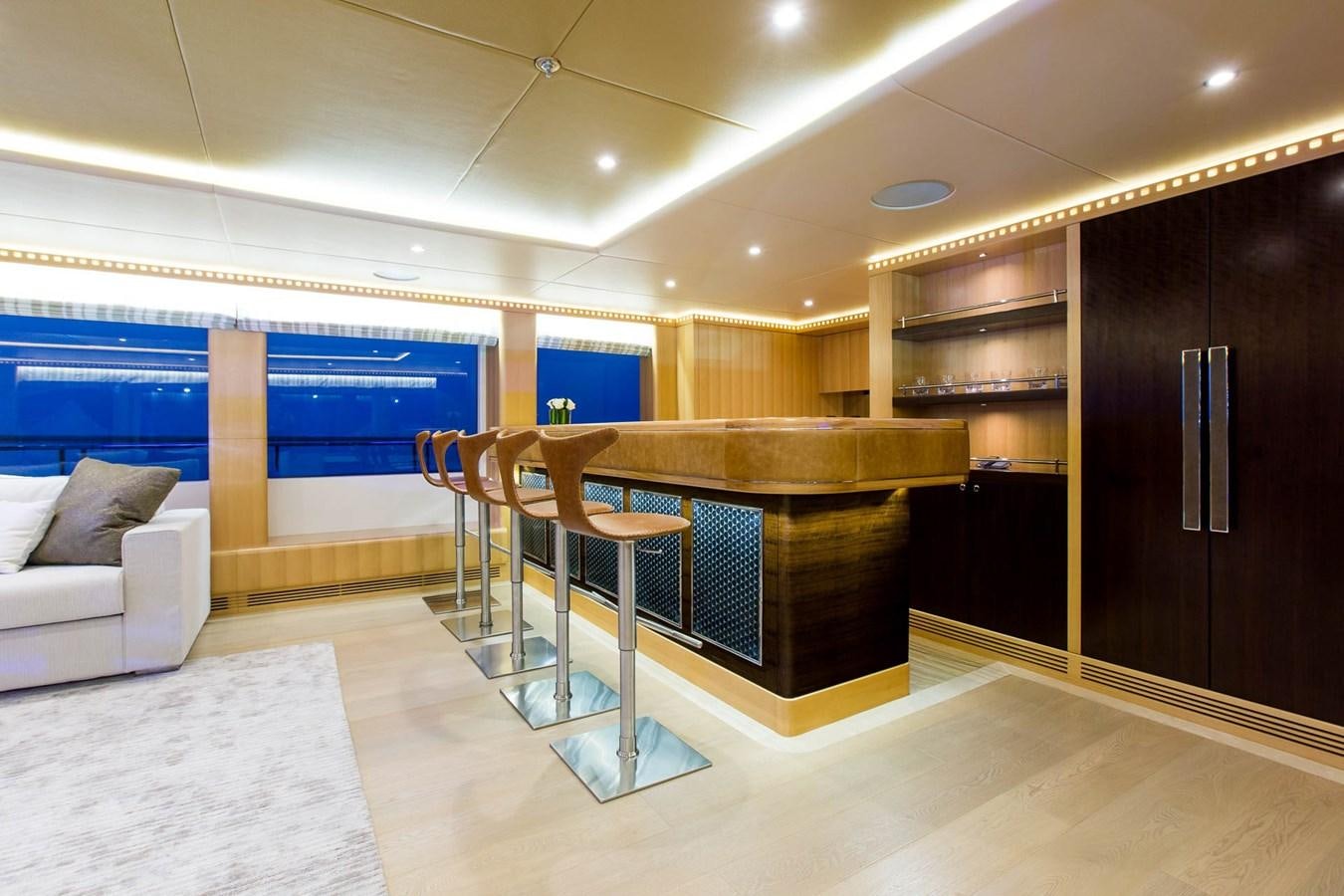 a room with a bed and a table aboard MAJESTY 155 Yacht for Sale