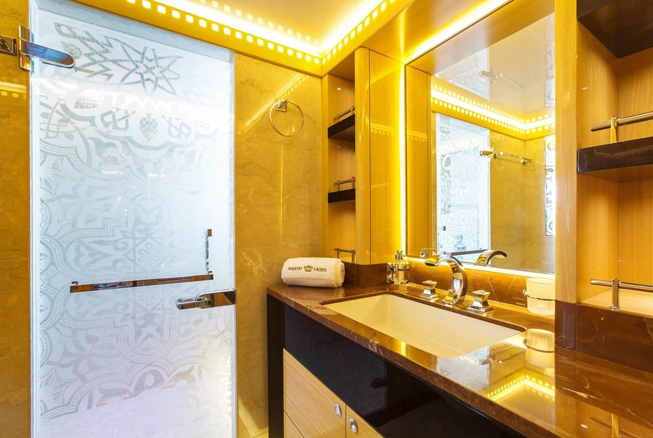 a bathroom with a sink and a mirror aboard MAJESTY 155 Yacht for Sale