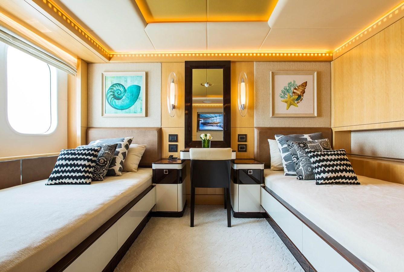 a room with a bed and a desk aboard MAJESTY 155 Yacht for Sale