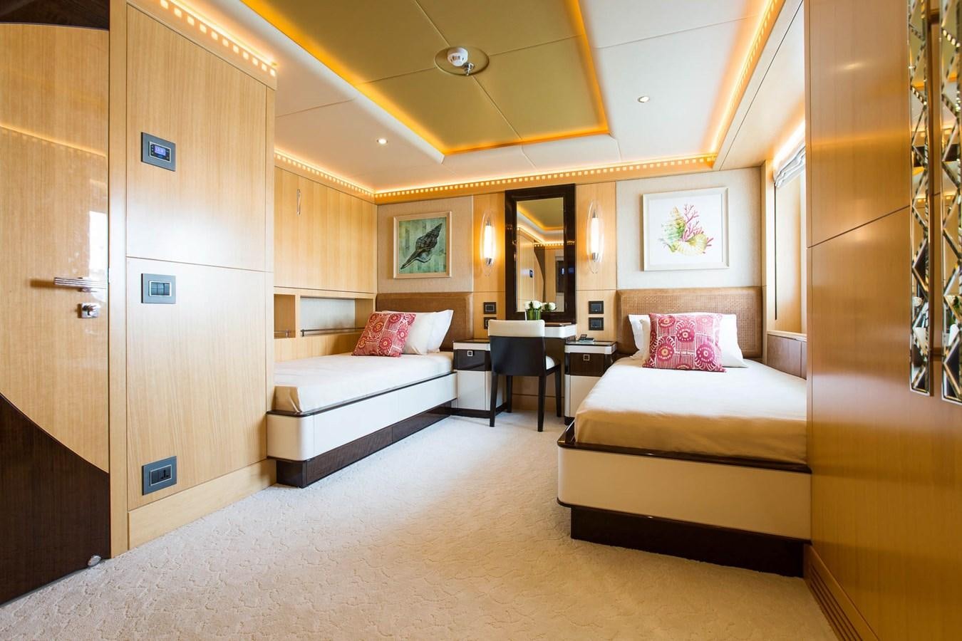 a room with a bed and a desk aboard MAJESTY 155 Yacht for Sale