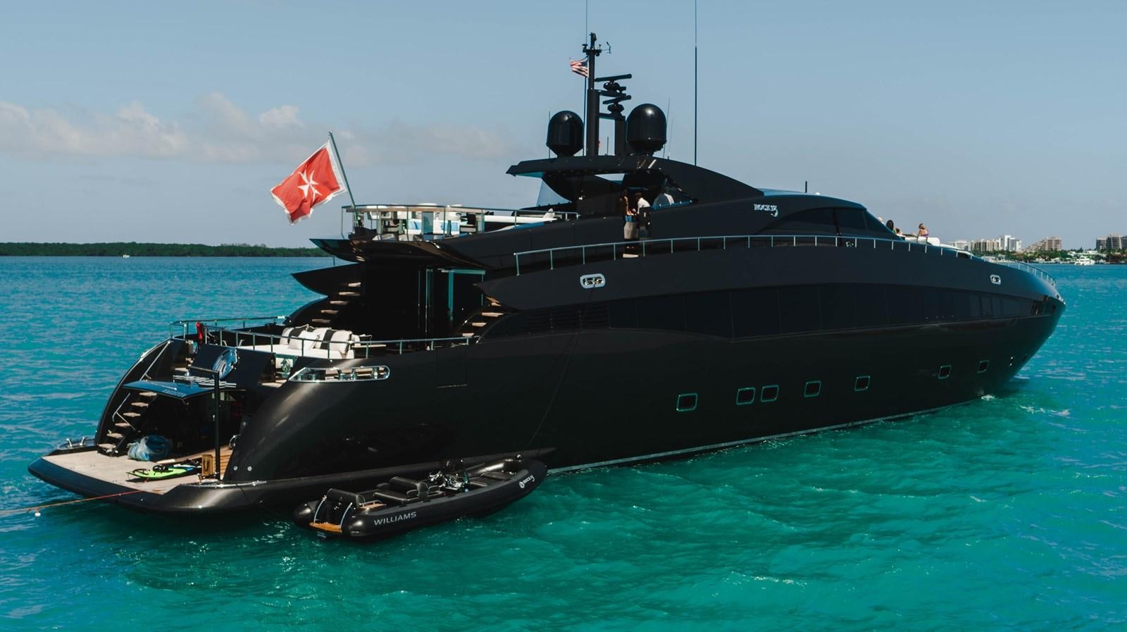 a large black ship in the water aboard AQUILA Yacht for Sale