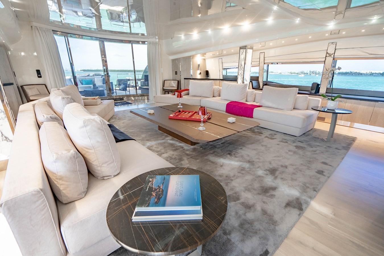 a living room with a large window aboard AQUILA Yacht for Sale