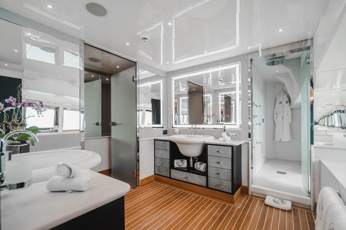 a bathroom with a large mirror aboard AQUILA Yacht for Sale