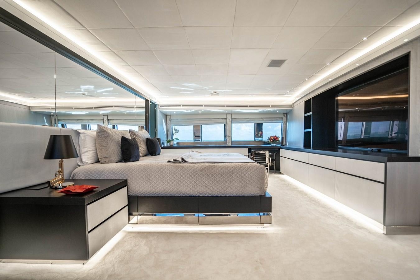 a large bedroom with a bed aboard AQUILA Yacht for Sale