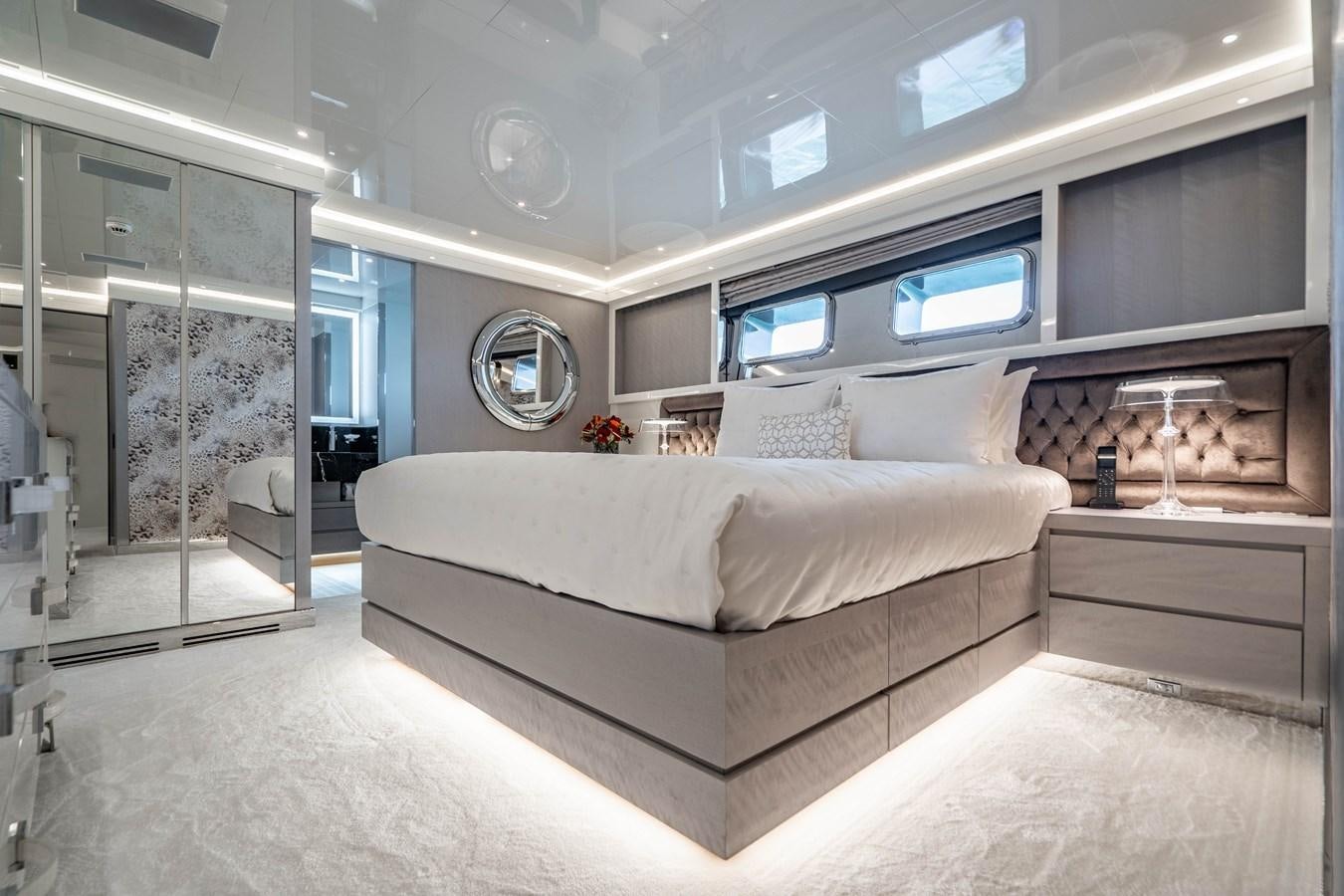 a large bed in a room aboard AQUILA Yacht for Sale