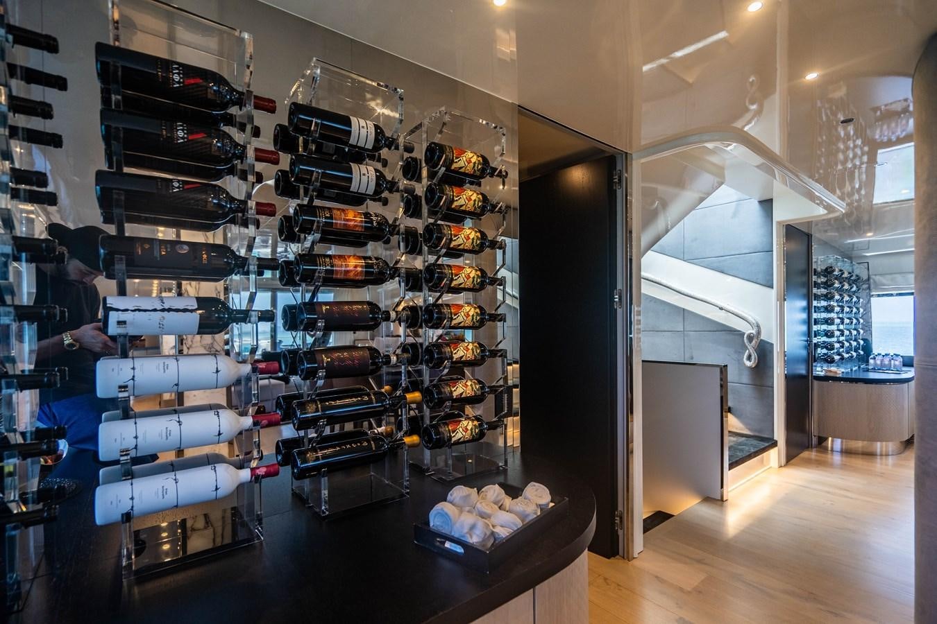 a room with shelves of games aboard AQUILA Yacht for Sale