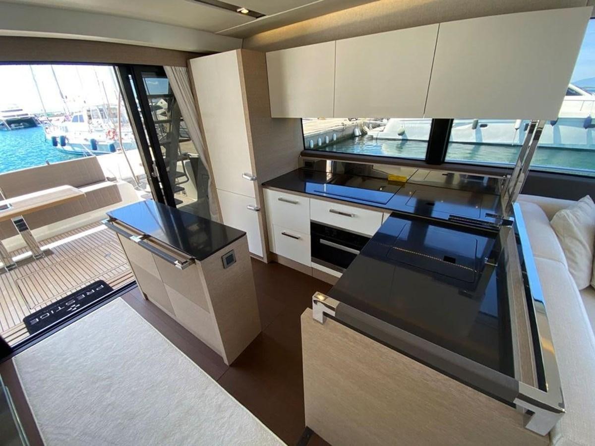 a kitchen with a large window aboard MEIGA Yacht for Sale