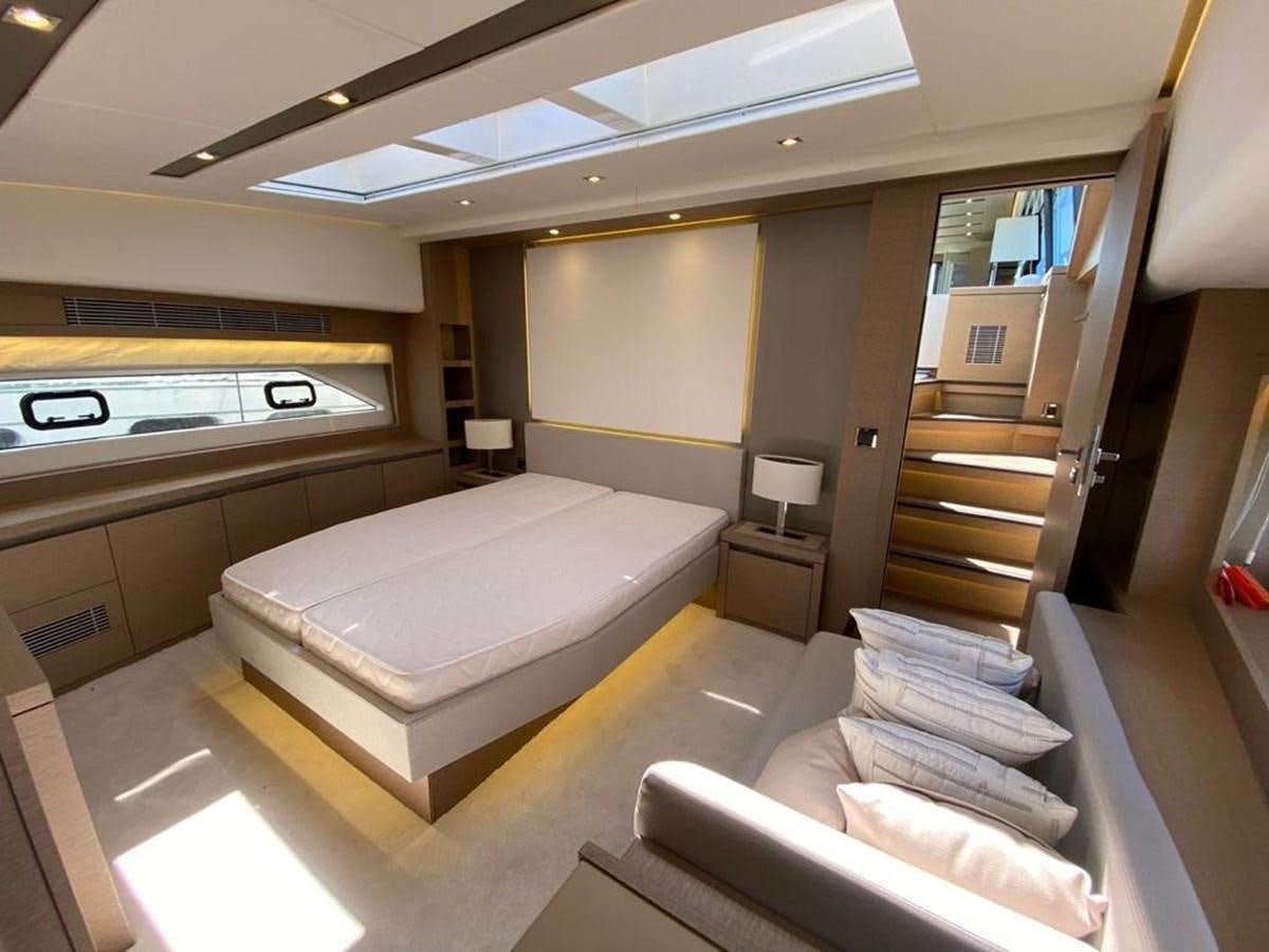 a room with a bed and a desk aboard MEIGA Yacht for Sale