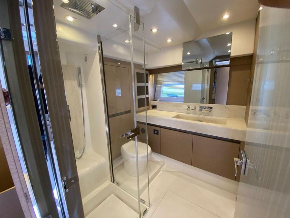 a bathroom with a glass shower aboard MEIGA Yacht for Sale