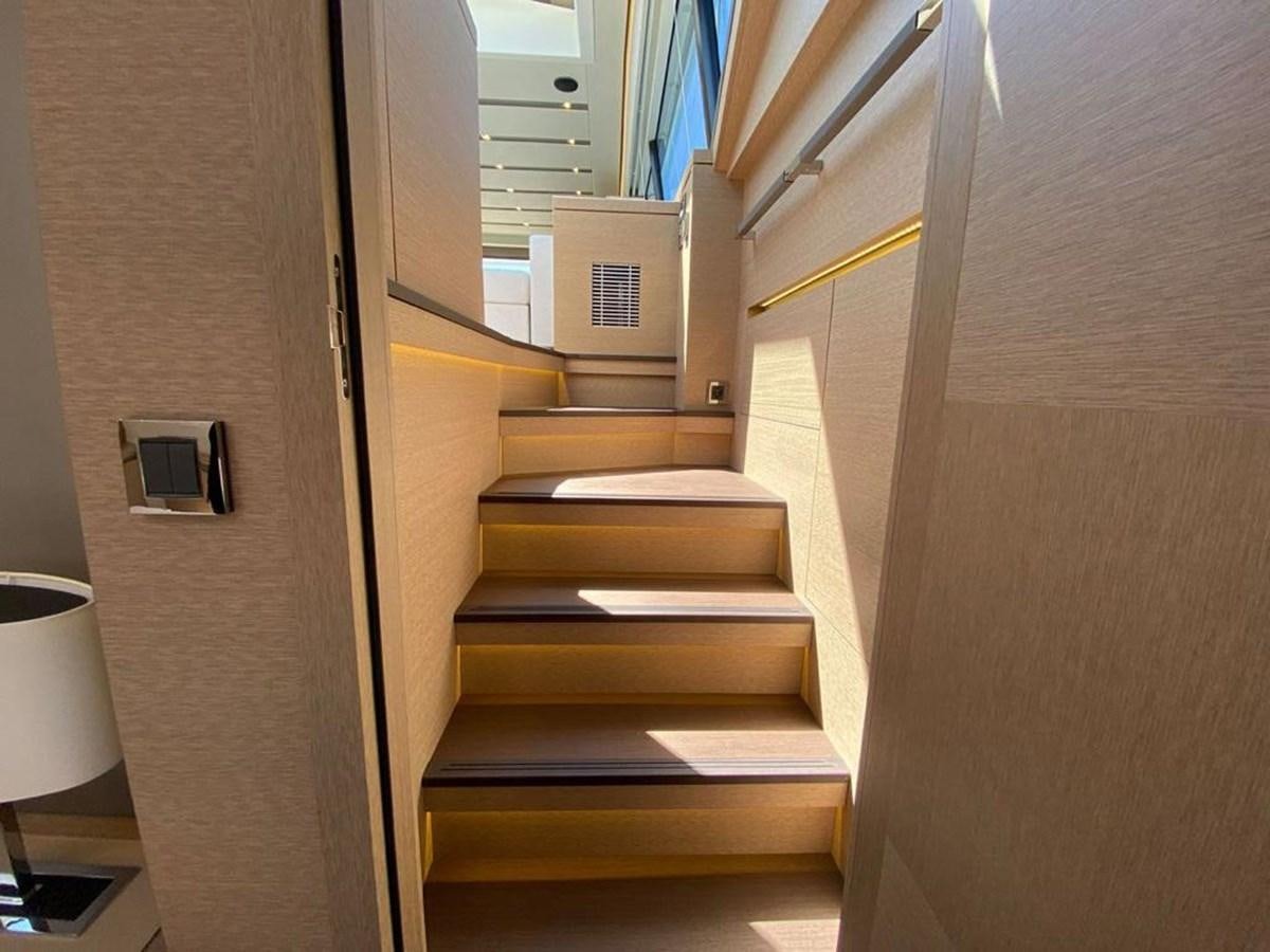 a staircase with a light on the side aboard MEIGA Yacht for Sale