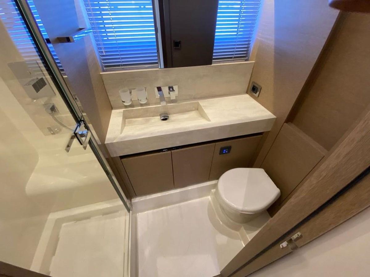 a bathroom with a toilet and a sink aboard MEIGA Yacht for Sale