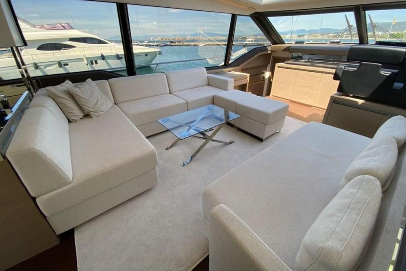 a living room with a large window aboard MEIGA Yacht for Sale