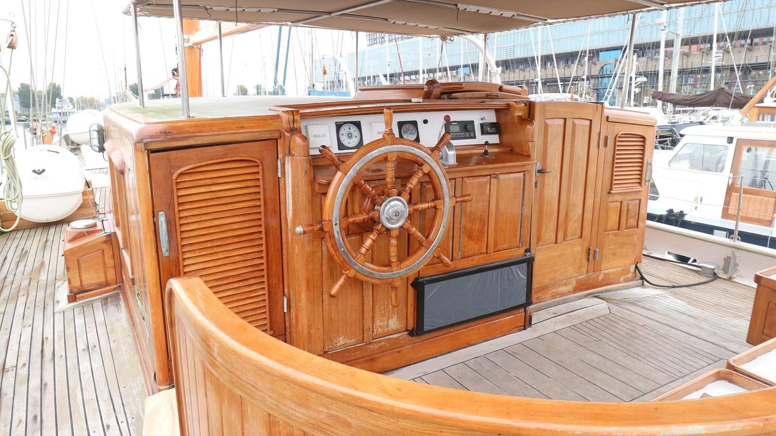 a wooden boat in a museum aboard ARIES Yacht for Sale